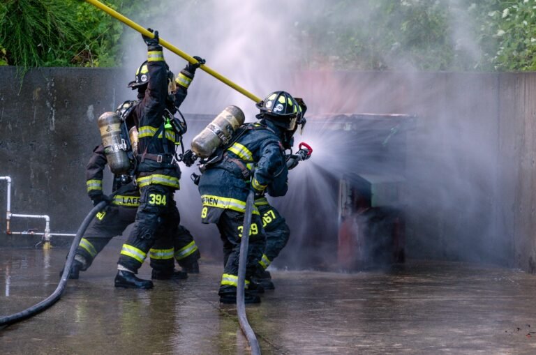 rear-view-firefighter-using-water-hose (1)