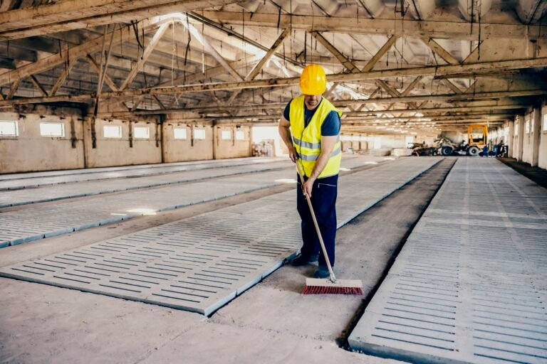 A worker in work wear cleaning facility